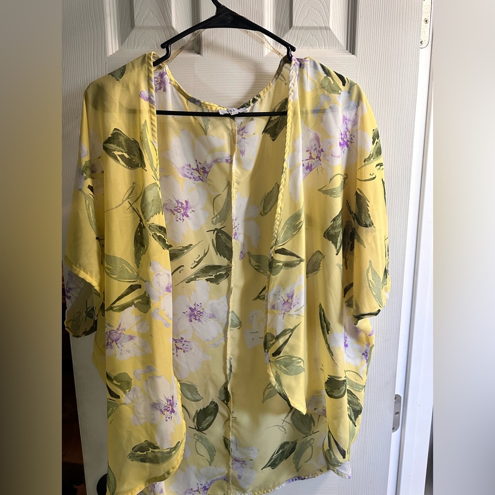 Cute cover up top to wear with a black dress